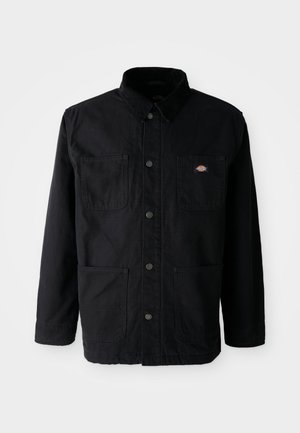 Black button-up jacket with four front pockets, corduroy collar, and small brand logo patch on upper right chest pocket.