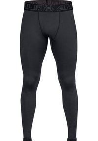 Schwarze Kompressionsleggins mit passgenauem Design, hergestellt aus glattem Material, ausgestattet mit einem breiten, markierten Bund und nahtloser Verarbeitung.
