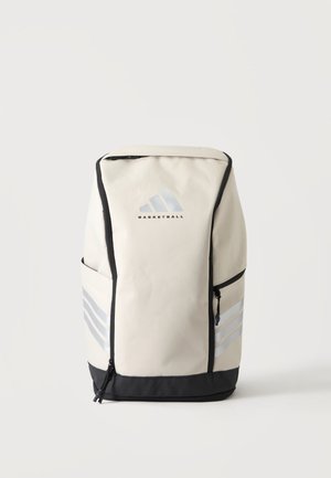 Grand sac à dos de sport blanc et noir avec poches latérales, fermetures éclair verticales et un logo de basket-ball au centre avant.