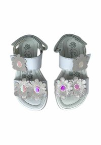 Sandali bianchi con accenti a forma di fiore in argento e gemme iridescenti. Chiusura a Velcro e suola imbottita per il comfort. Suole interne con motivo floreale.