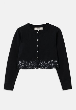 Black long-sleeve cropped cardigan with round neckline, front buttons, and intricate floral lace detailing along the hem.