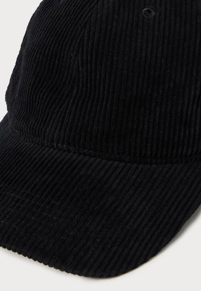 Black corduroy baseball cap with a curved brim and visible stitching on the fabric texture.