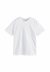 Camiseta de algodón blanca con cuello redondo y mangas cortas. Textura suave, corte clásico y sin patrones ni acentos visibles.