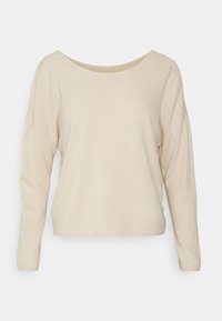 Lichtbeige gebreide trui met een relaxte pasvorm, brede halslijn en lange mouwen. Voorzien van geribbelde manchetten en zoom, zachte textuur.