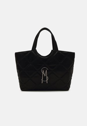 Black quilted tote bag with dual handles and a silver monogram logo centered on the front panel against a white background.