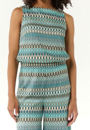 Tenue sans manches avec un motif ondulé en bleu sarcelle, brun et crème. Confectionnée dans un tissu lisse avec une coupe décontractée à la taille.