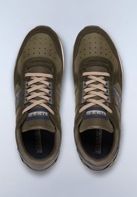 Olive green sneakers with suede and mesh materials, featuring a beige lace system, perforated toe, and blue logo accents on the sides.
