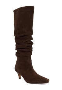 Brown suede knee-high boot with a slouched design, pointed toe, and a small angled heel. Smooth texture with soft, rich color.