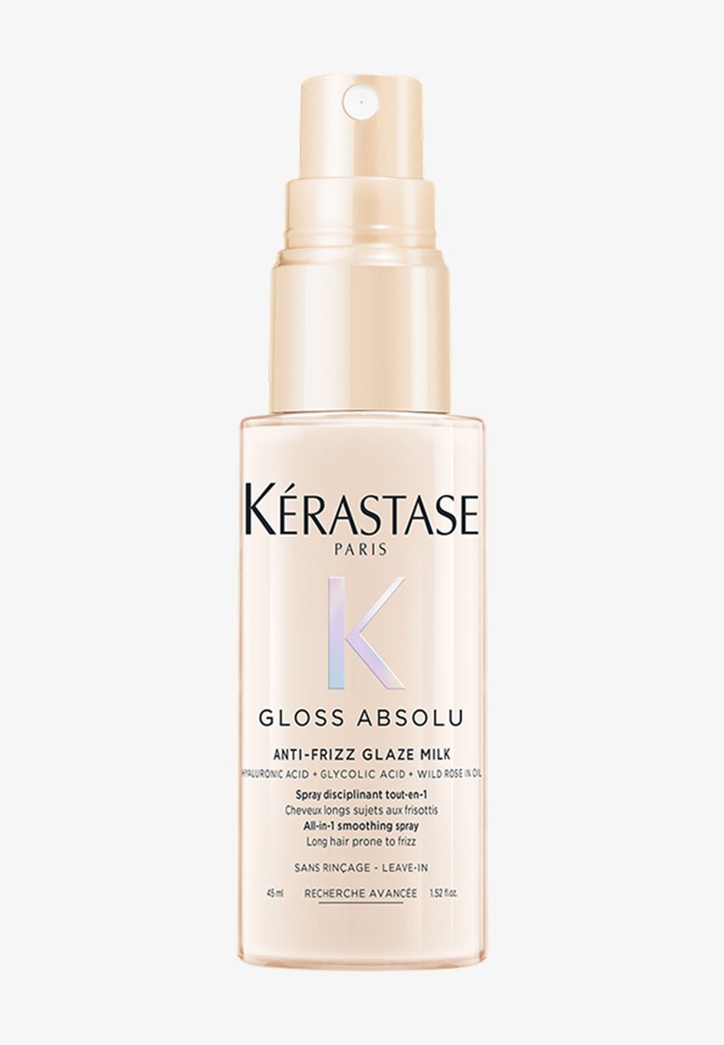 Kérastase Gloss Absolu anti-frizz glazuur melk sprayfles voor het gladmaken en temmen van lang, kroezend haar, 45 ml, beige en transparante verpakking.