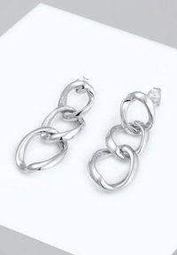 Hõbedased kõrvarõngad, millel on omavahel ühendatud ovaalsed ja ringikujulised kujundid, millel on poleeritud viimistlus, pakkudes sujuvat ja peegeldavat tekstuuri.