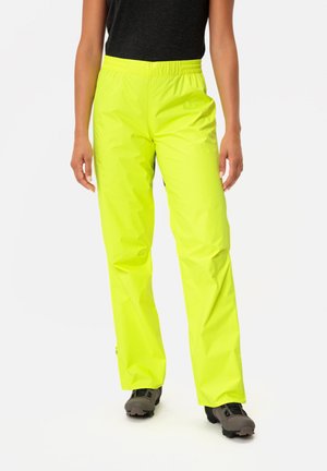 Bright neon yellow waterproof pants with an elastic waistband, tapered legs, and smooth, shiny texture. Designed for active use.
