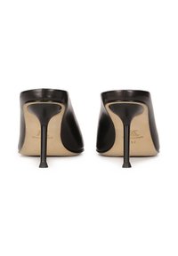 Black leather high-heel shoes with a smooth finish, sculpted back, and slim stiletto heel. Features a beige inner lining and branding.