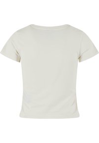 Lys beige t-skjorte med korte ermer og rund hals, laget av glatt og lett bomull. Ingen synlige mønstre eller detaljer.
