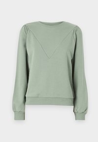 Sudadera verde hecha de material suave. Presenta un cuello redondeado, mangas largas abullonadas y un detalle de diseño en forma de V en el frente.