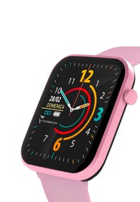 Smartwatch con quadrante quadrato nero, motivi circolari colorati, cinturino in silicone rosa e pulsante laterale. Il display mostra la data e l'indicatore della batteria.