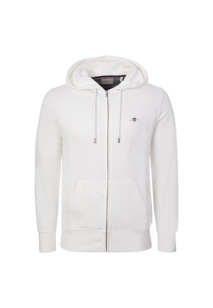 White full-zip hoodie with front pockets, drawstring hood, ribbed cuffs, and a small embroidered logo on the left chest.