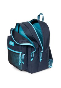 Zaino blu navy con cerniere e dettagli turchesi; presenta diversi scomparti, una tasca laterale in rete e spallacci imbottiti.