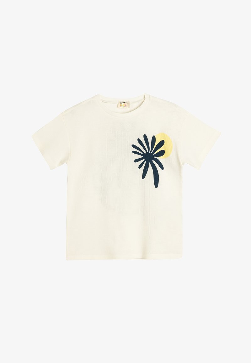 Camiseta de manga corta color crema con un gráfico de hoja de palma azul oscuro y un diseño de sol amarillo en la parte frontal. Material de algodón.