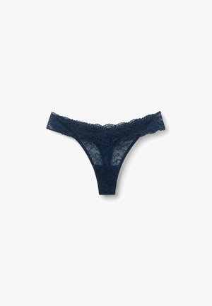 Navy blue lace thong with floral pattern, sheer fabric, and scalloped edges along the waistband and leg openings. Features minimal coverage design.