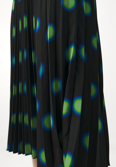 Black pleated skirt featuring multicolored circular patterns in green and blue hues, highlighting a lightweight fabric texture and smooth finish.