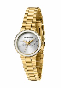 Orologio color oro con quadrante argento a motivo raggiante, caratterizzato da un design minimalista distintivo e un cinturino robusto a maglie.