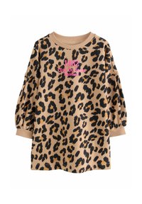Un pull beige avec un imprimé léopard noir et marron, doté de manches bouffantes et de poignets côtelés. Texte en rose : "1982 Club Du Sport Athlétisme."