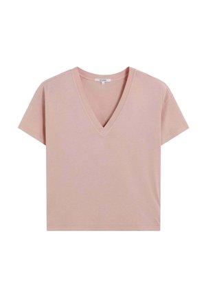Camiseta de algodón rosa suave, de manga corta y con escote en V, que presenta un corte relajado y un diseño liso, con detalles de costura en el dobladillo y el escote.
