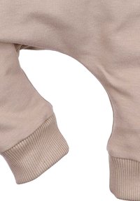 Licht beige sweatshirt stof, met ribbelmanchetten en een losse ontwerp met drop schouders. Soepele textuur, minimalistische stijl.