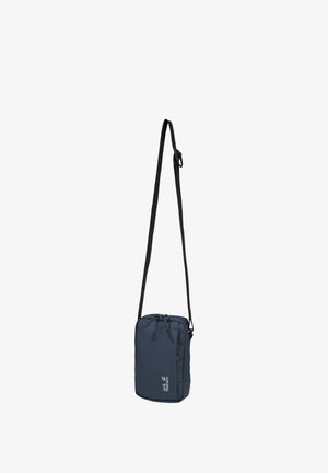 Borsa a tracolla compatta color blu navy con tracolla nera regolabile e cerniera visibile, con logo "Jack Wolfskin" bianco.