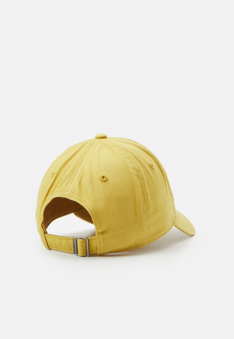 white and gold nike hat