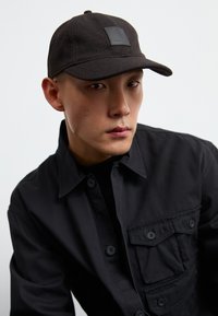 Carhartt WIP TRUMAN UNISEX - Naģene - chocolate/black