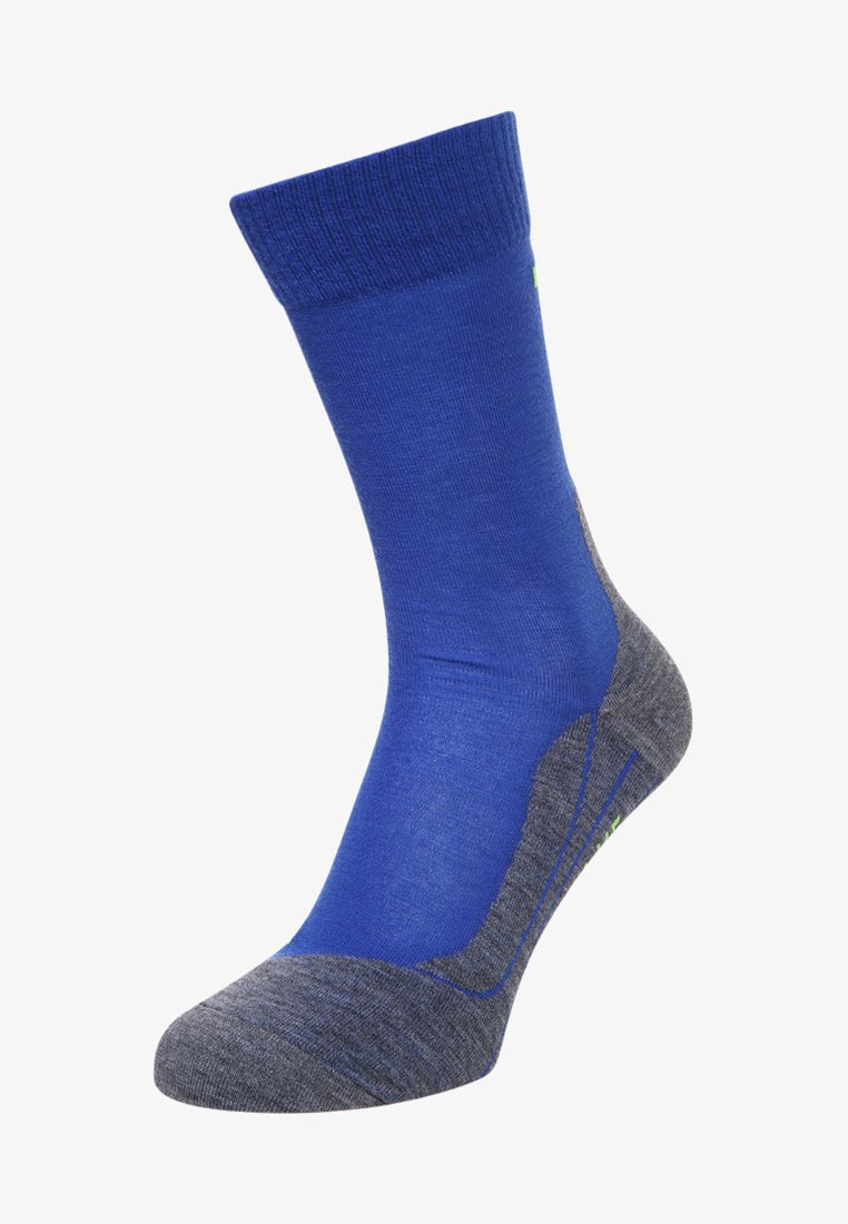 Calzino blu e grigio con polsino a coste, soletta imbottita e dettagli in un verde chiaro. Presenta una texture liscia e un design sportivo.