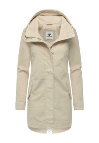 Hellbeige lange Jacke mit Kapuze, Frontreißverschluss und zwei seitlichen Taschen. Hergestellt aus leichtem Stoff mit glatter Textur.