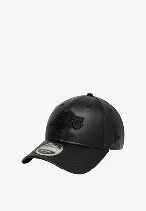 Black leather baseball cap featuring an embossed logo, rounded crown, stiff brim, and subtle stitching details. Six ventilation eyelets present.