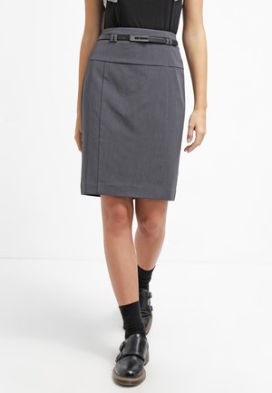 Gray knee-length pencil skirt with a slim belt, worn with black socks and black buckle shoes, shown on a walking model.