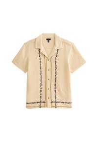 Short-sleeve beige shirt featuring textured fabric, black floral embroidery down the front, and brown buttons. Casual design with a collar.