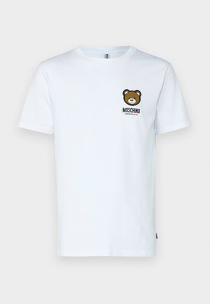 T-shirt de algodão branco com uma imagem de urso no lado esquerdo do peito e o texto "MOSCHINO UNDERBEAR". Mangas curtas, com design de gola redonda.