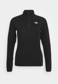 Černá mikina s dlouhým rukávem z fleecu se čtvrtinovým zipem a bílým logem The North Face na levé části hrudníku.