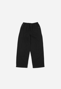 Svarte joggebukser med elastisk midjebånd, avslappet passform og sidelommer. Laget av mykt stoff med en jevn tekstur.