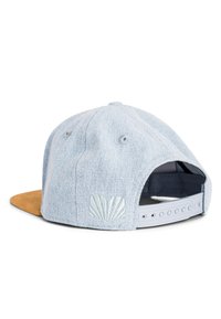 Denim baseball cap with a light blue fabric and a tan suede visor. Features a textured shell design and adjustable snapback closure.