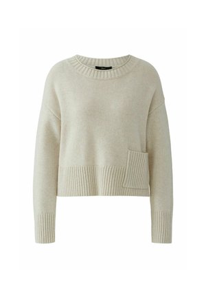 Pull en maille beige clair avec un large ourlet côtelé et des poignets de manches côtelés. Présente une poche avant avec texture côtelée. Encolure ronde.