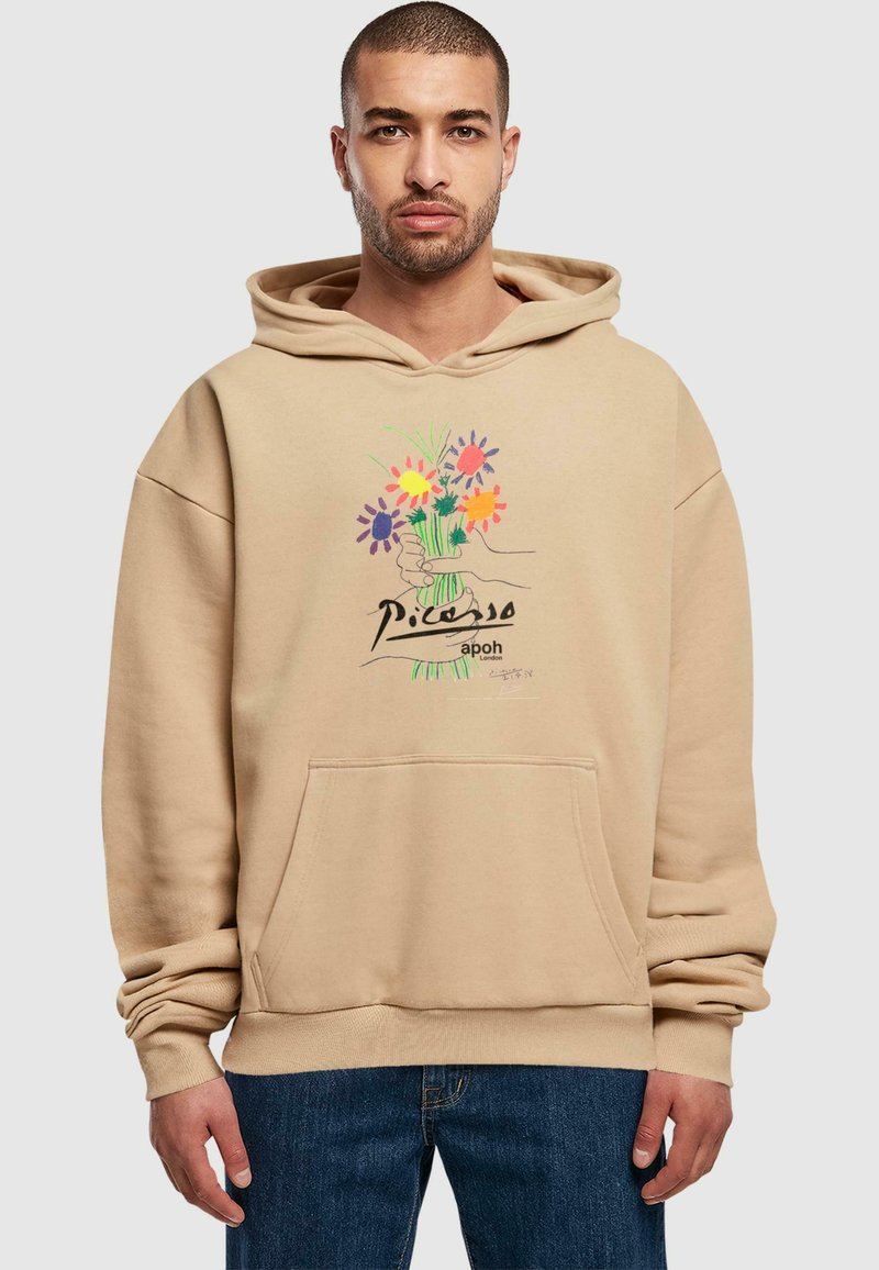 Felpa beige con tasca frontale e stampa grafica di fiori colorati con un design a mano. Realizzata in tessuto morbido, con polsini e orlo a costine.