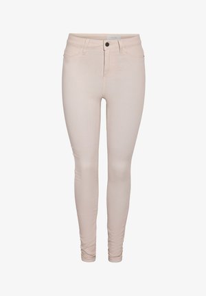Light beige skinny jeans with button and zip closure, front and back pockets, and belt loops.