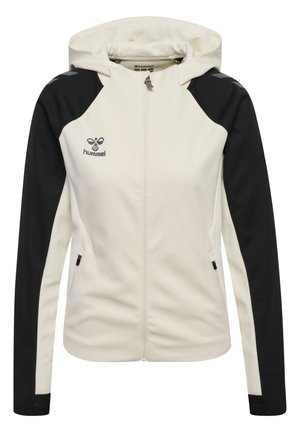 Witte en zwarte dames hoodie met rits, voorzakken en hummel-logo op de borst, getoond op een witte achtergrond.