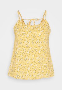 Top floreale giallo con sottili spalline regolabili, caratterizzato da un dettaglio con nodo sullo scollo e una vestibilità ampia e fluida. Il tessuto ha una consistenza morbida e leggera.