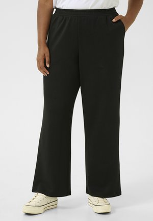 APRILA - Tracksuit bottoms - black deep