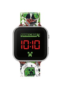 Montre numérique avec un écran LCD noir affichant des chiffres rouges à 10h10. Elle possède un bracelet multicolore avec des graphiques et motifs sur le thème de Minecraft.