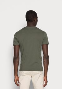 Olive green short-sleeve t-shirt with a crew neckline and a fitted design, made from soft fabric, displayed from the back.