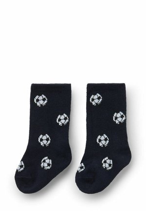 Marineblaue Socken aus weichem Stoff, mit weißen Fußballmustern überzogen. Gerippte Textur mit klassischer Knöchelhöhe.