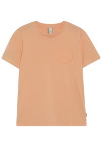 Pfirsichfarbendes Baumwoll-T-Shirt mit kurzen Ärmeln, das ein kreisförmiges Logodesign in einem ähnlichen Farbton im Brustbereich aufweist.